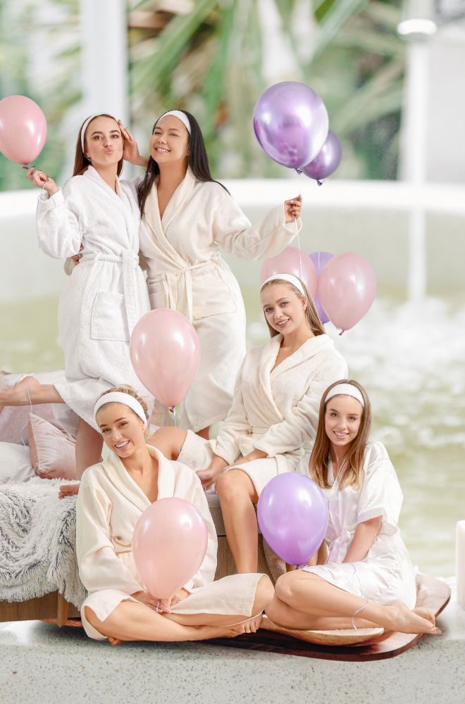 Guests enjoying facials and relaxation at a pamper party